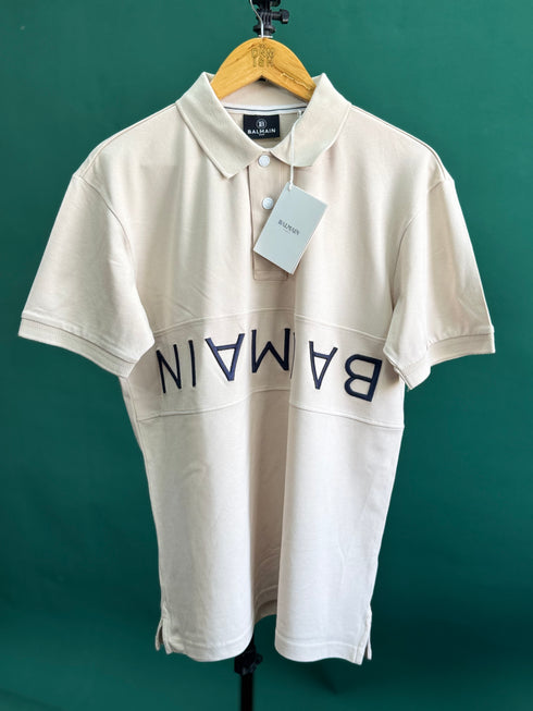 BALMAIN TEXT REVERSE EMBROIDERY POLO SHIRT | CREAM