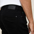 Jules UrbanFlex slim fit jeans in black for men.