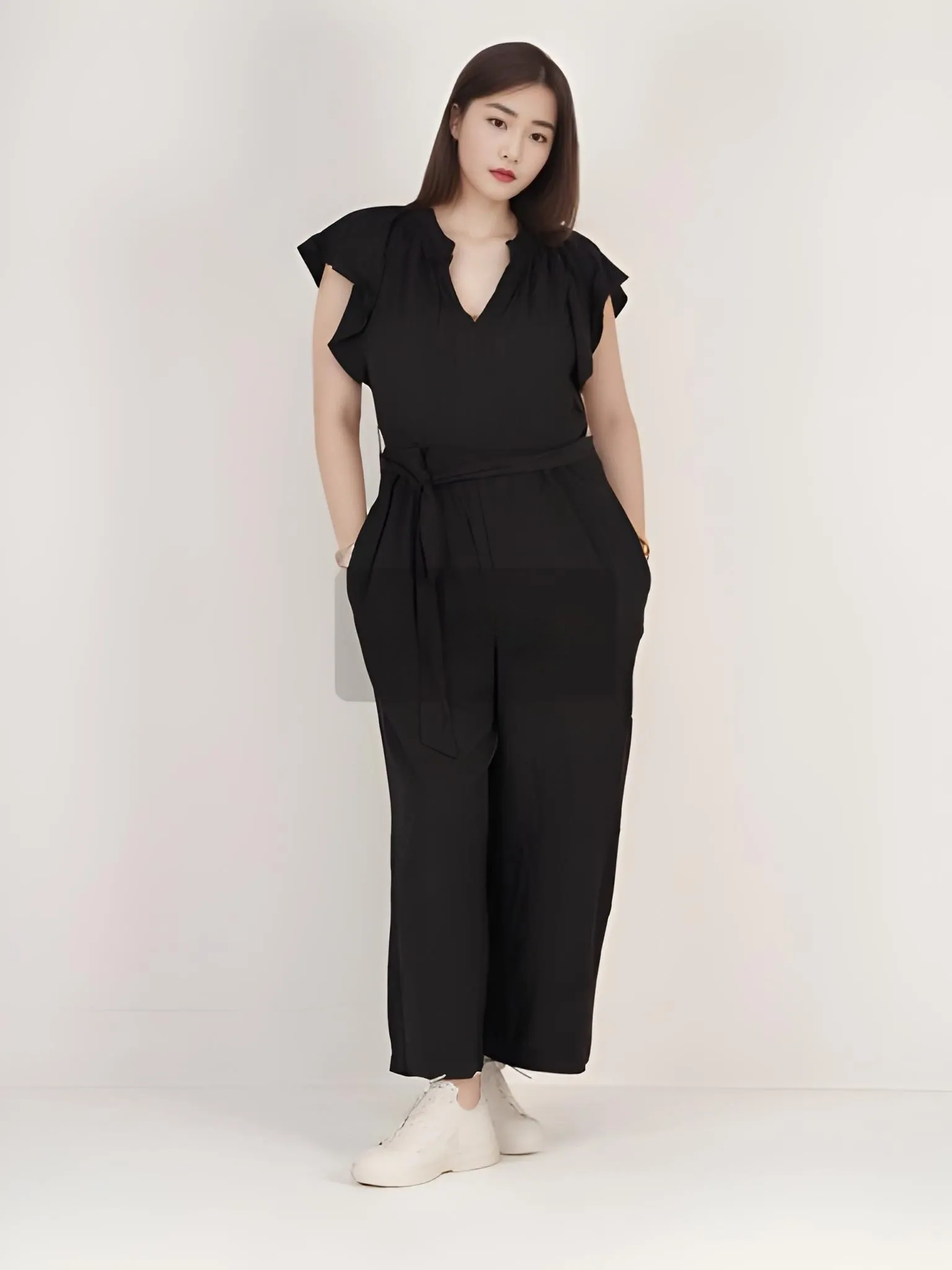 CALVIN KLEIN WOMENS SLEEVELESS WRAP JUMPSUIT | BLACK